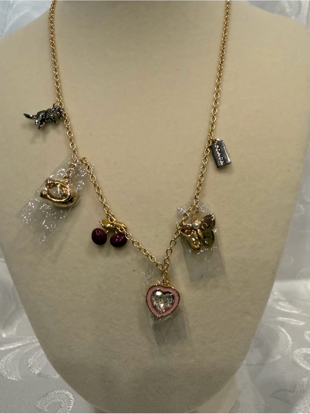 Coach Gold Charm Necklace. New